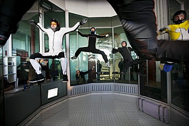 Simulated freefall like a parachute jump, at the Indoor Skydiving Bottrop GmbH, parachute freefall simulation facility, a vertical wind tunnel, largest and most modern in Europe, Bottrop, North Rhine-Westphalia, Germany