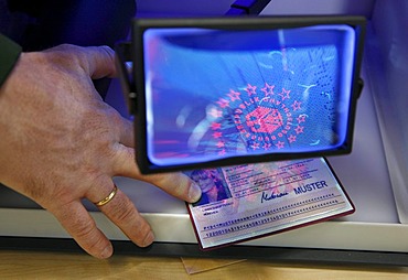 Police inspection, validating documents, passport, using UV light and a magnifying glass, mobile control station of the highway patrol, Muenster, North Rhine-Westphalia, Germany, Europe