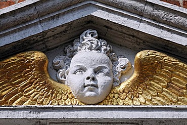 Angel head with golden wings, Renaissance portal of a city palace from the 17th century, Hoorn, Province of North Holland, Netherlands, Europe