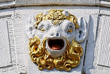 Head of a mythical creature with an open mouth and a golden beard, facade relief on a city palace from the 17th century, Hoorn, Province of North Holland, Netherlands, Europe