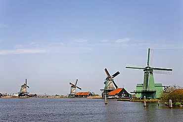 Historic windmills at the river Zaan, open-air museum Zaanse Schans, Zaanstad, Province of North Holland, Netherlands, Europe