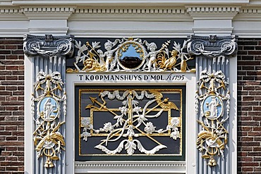 Elaborate ornaments on the portal of a Dutch merchant house from the 18th century, open-air museum Zaanse Schans, Zaandam, North Holland, Netherlands, Europe