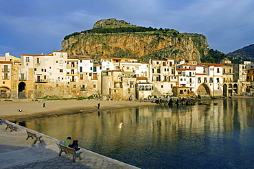 Old port Mt. La Rocca, young couple, moorish architecture town of Cefalu, Province of Palermo, Sicily, Italy