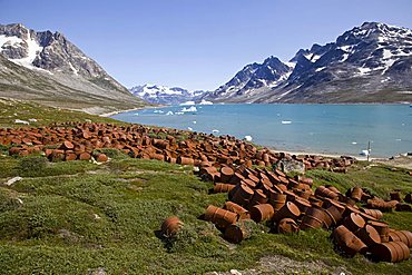 Rusty barrels at the former U.S. military base, Ikateq Sound, Sermiligaq Fjord, Ammassalik District, East Greenland, Greenland, Denmark