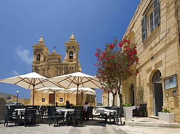 Street cafe with the cathedral in San Lawrenz on the island of Gozo, Malta, Europe