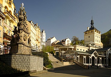 Castle road with plague column, castle tower and market colonnade, Karlovy Vary, West Bohemia, Czech Republic, Europe