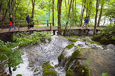 Tourists on the path at Plitvicka Jezera, Plitvice Lakes National Park, Lika-Senj, Croatia, Europe