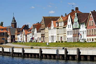 Glueckstadt, historic row of houses at the inland port with Wiebke Kruse-tower in the back, district Steinburg, Schleswig-Holstein, Germany, Europe