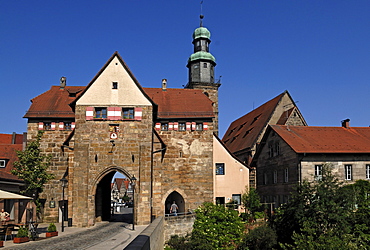 Historic gate, Nuernberger Tor, in front of the tower of the Nikolai Church, Lauf an der Pegnitz, Middle Franconia, Bavaria, Germany, Europe