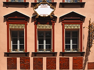 Decorative and renovated facade with tile reliefs of craftman's trades in the historic town centre, Nuremberg, Middle Franconia, Bavaria, Germany, Europe