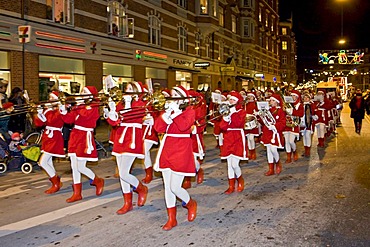 Christmas parade with young girls playing brass band music, Copenhagen, Denmark