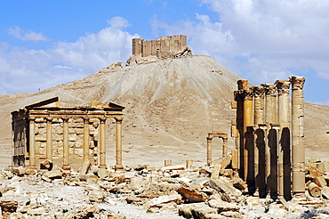 Ruins in the Palmyra archeological site, in the back castle Qala'at Ibn Ma'n, Tadmur, Syria, Asia