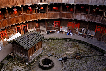 Courtyard with a fountain of a Tulou round house, dirt round houses, adobe round houses, the Chinese minority Hakka, near Yongding and Hukeng, Fujian, China