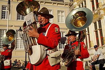 Brass band Groep Sint Leo marching through the historic center of Bruges, Belgium, Europe