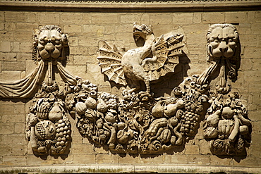 Dragons from the Borghese family coat of arms on the facade of the Hotel des Monnaies in Avignon, Provence, France, Europe