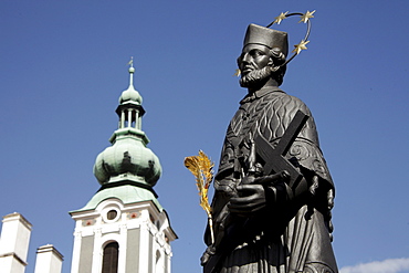 Statue of Saint John of Nepomuk on Lazebnicky Most bridge and St. Jost Church, &eskË Krumlov, Czech Republic, Europe