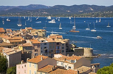 View over the roofs on the bay of Saint-Tropez during the sailing regatta "Les Voiles de Saint-Tropez" in Saint-Tropez, Departement Var, Cote d'Azur, Provence, Southern France, France