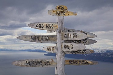 Signpost showing the distance to several cities, skiing area on Fagernes-Fjellet Mountain above Narvik and Ofotfjord, Narvik, Norway, Europe