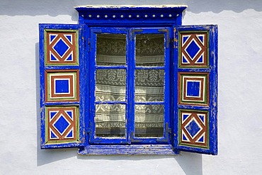 Colourful window at a farm house in the Bucharest village museum, Muzeul National Al Satului Dimitrie Gusti, Bucharest, Romania