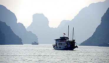 Ship in front of rock formations, Halong Bay, Vietnam, Southeast Asia