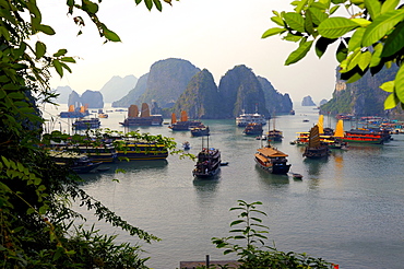 Ships in front of rock formations, Halong Bay, Vietnam, Southeast Asia