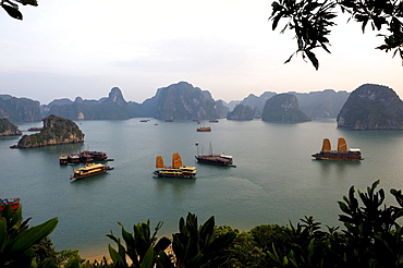 Ships in front of rock formations, Halong Bay, Vietnam, Southeast Asia