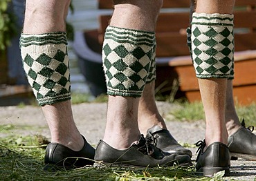 Man wearing so called Wadelwaermer, diamond-patterned woolen accessoire for keeping the calves warm, Bavarian costume, in Seehausen, Bavaria, Germany, Europe