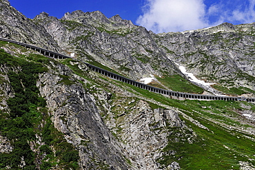 New Gotthardpass Road leading through an open tunnel on the mountain, Switzerland, Europe