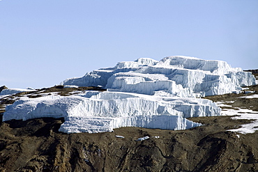 Aerial view of Mt. Kilimanjaro 19335 ft. or 5895 m, spectacular ice cliffs of the Eastern Icefield, Tanzania, Africa