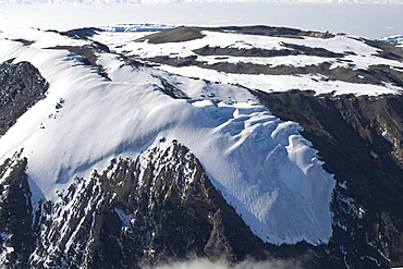 Aerial view of Mt. Kilimanjaro 19335 ft. or 5895 m, Rebmann Glacier in the foreground, summit ridge and crater floor, Tanzania, Africa