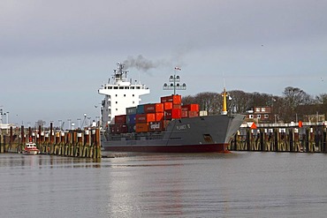 Container ship leaving the lock of the Kiel canal in Brunsbuettel, Brunsbuettel, district Dithmarschen, Schleswig-Holstein, Germany,