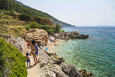 Rocky Coast and Beach near Zavala, mother and child, Hvar Island, Dalmatia, Croatia, Adriatic Sea, Mediterranean, Europe