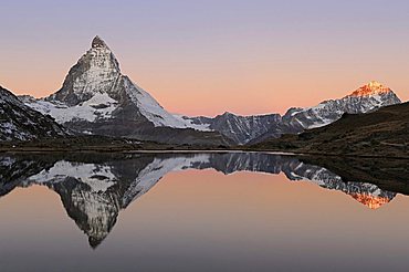 Matterhorn reflection in Riffelsee, Zermatt, Wallis, Switzerland, Europe