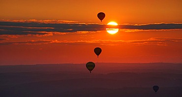 Aerial photograph, hot-air balloons, International Mongolfiade, start at the Warsteiner Brewery, sunset, Hirschberg, Warstein, Sauerland, North Rhine-Westphalia, Germany, Europe