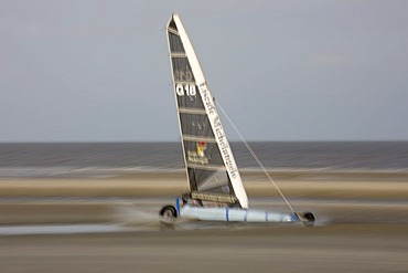 Beach sailer spraying water in St Peter Ording, North Sea, North Frisia, Schleswig-Holstein, Germany, Europe