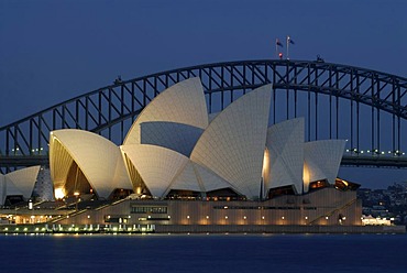 Sydney Opera House with Sydney Harbor Bridge in the back at night, Sydney, New South Wales, Australia