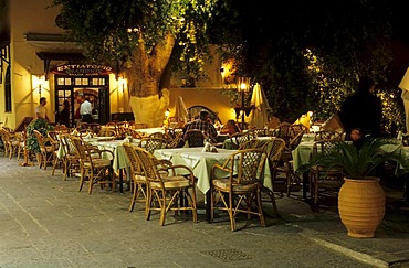 Evening atmosphere in a restaurant in the historic centre of Rhodes City, Rhodes Island, Greece, Europe