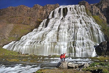 Waterfall Dynjandi rather Fjallfoss, hiker, West Fjord, Iceland, Europe