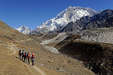 Trekking group at the Khumbu Glacier with Mount Nuptse, 7861m, Sagarmatha National Park, Khumbu Himal, Nepal, Asia