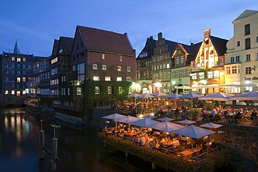 Restaurant terraces at dusk, Old Port, Lueneburg, Lower Saxony, Germany, Europe