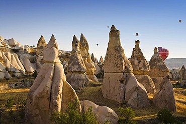 Hot air balloons and tuff rock landscape near Goereme, Cappadocia, Central Anatolia, Turkey, Asia