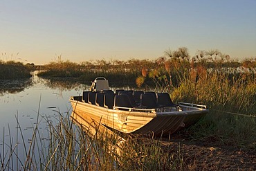 Excursion boat on the Nguma Lagoon on the Okawango River, Botswana, Africa