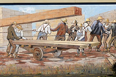 Men loading wood, large mural on the history of Canada, Chemainus, Vancouver Island, Canada, North America