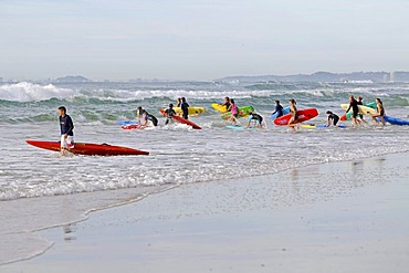 Young surfers on the beach of Surfers Paradise, Queensland, Gold Coast, Australia