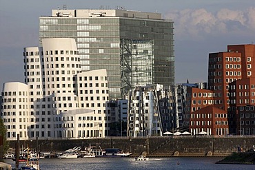 Media Harbour, Neuer Zollhof, buildings designed by the architect Frank Owen Gehry, in front of the Stadttor building, Duesseldorf, North Rhine-Westphalia, Germany, Europe