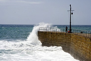 Surf on Porthleven harbour wall, Cornwall, Great Britain, Europe