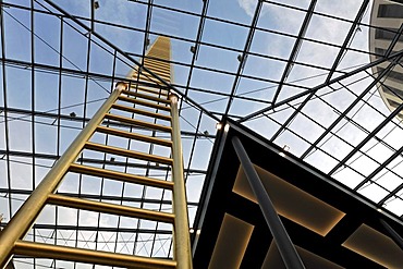 Golden ladder soaring into the sky, through glass roof, artistic landmark of the new Forum Duisburg Shopping Centre, Shopping Mall, city centre, Ruhr area, North Rhine-Westphalia, Germany, Europe - Propertyrights MultiMallManagementDuisburgGmbH