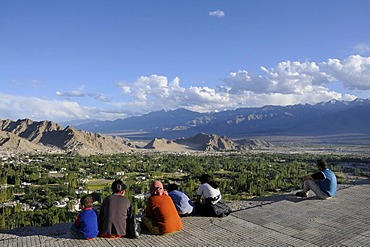 Overlooking the oasis Leh into the Indus Valley, in the foreground Ladakhi people, Ladakh, Northern India, the Himalayas