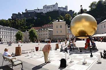 Kapitelplatz with sculpture 'Sphaera' by Stephan Balkenhol, chess players, Festung Hohensalzburg, Salzburg, Austria, Europe