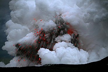 Smoke- and gas clouds and explosions where the Kilauea Volcano lava and the waters of the Pacific Ocean meet, Kalapana, Big Island, Hawai'i, Hawaii, USA